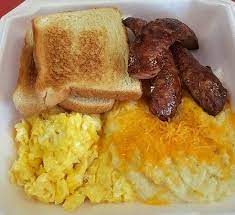 a box breakfast with toast sausage eggs and hashbrowns